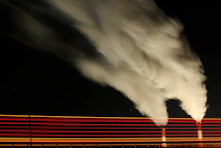 In this Jan. 19, 2012 file photo, smoke rises in this time exposure image from the stacks of the La Cygne Generating Station coal-fired power plant in La Cygne, Kan. The Environmental Protection Agency on Tuesday, April 18, 2017, asked a federal appeals court in Washington to postpone consideration of 2012 rules requiring energy companies to cut emissions of toxic chemicals.