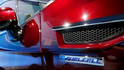 The fuel cell logo adorns the fender of the Honda Clarity at a media preview at the New York International Auto Show, at the Jacob Javits Center in New York, Wednesday, April 12, 2017.