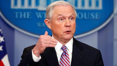 In this March 27, 2017, file photo, Attorney General Jeff Sessions speaks in the Brady Press Briefing Room of the White House in Washington. The Trump administration issued a stern warning to U.S. companies as they began applying for coveted skilled-worker visas Monday, cautioning that it would investigate and prosecute employers that overlook qualified American workers for the jobs.