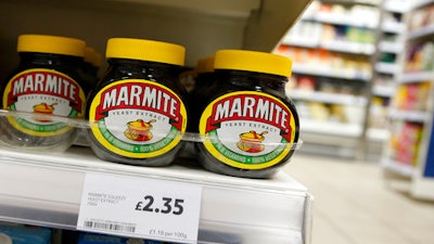 This is a Thursday, Oct. 13,2016 file photo of jars of savoury spread 'Marmite' which is owned by the Anglo-Dutch multinational Unilever, on sale in a supermarket in central London. Consumer products giant Unilever said Thursday April 6, 2017 that it plans to sell its spreads division and combine its foods and refreshments units as part of a major review of operations prompted by a $143 billion takeover bid by rival Kraft Heinz that fell through in February.
