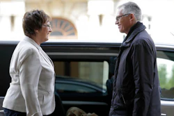 Carlos Tavares, CEO of PSA Peugeot Citroen, right, and German Minister for Economic Affairs and Energy, Brigitte Zypries, left, talk as they arrive for a meeting in Berlin, Germany, Wednesday, April 5, 2017.