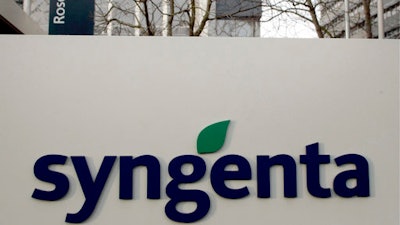 This Feb. 7, 2007 file photo shows the logo and headquarters of the Swiss agribusiness giant Syngenta in Basel, Switzerland. U.S. regulators have agreed to a Chinese conglomerate’s proposed $43 billion acquisition of Syngenta on condition it sells some businesses to satisfy anti-monopoly objections. The Federal Trade Commission’s announcement on Tuesday, April 4, 2017, follows approval last year by European regulators of the purchase by state-owned ChemChina. It would be China’s biggest foreign acquisition to date.