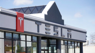 In this April 1, 2015, file photo, shows the Tesla Motors showroom in Salt Lake City. The Utah Supreme Court has ruled against Tesla in a push to sell its sleek, all-electric vehicles in the state. The court said in an opinion issued Monday, April 3, 2017, that Utah's State Tax Commission was correct in a 2015 decision denying Tesla a license to tell its cars in Utah.