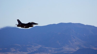 An F-16C makes a pass over Nevada's Tonopah Test Range after a March test of a mock nuclear weapon as part of a Sandia National Laboratories life extension program for the B61-12. Teams will spend months analyzing the data gathered from the test.