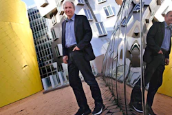 In this Monday, April 3, 2017, photo, Tim Berners-Lee poses outside his office at the Massachusetts Institute of Technology in Cambridge, Mass. Berners-Lee, best known as the inventor of the World Wide Web, is this year's recipient of the A.M. Turing Award, computing's version of the Nobel Prize. The honor comes with a $1 million prize funded by Google, one of many companies that made a fortune thanks to Berners-Lee's efforts to make the internet more accessible and useful.