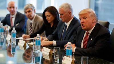 President Donald Trump speaks during a meeting with technology industry leaders at Trump Tower in New York, Wednesday, Dec. 14, 2016. From left are, Amazon founder Jeff Bezos, Alphabet CEO Larry Page, Facebook COO Sheryl Sandberg, Vice President-elect Mike Pence, and Trump.