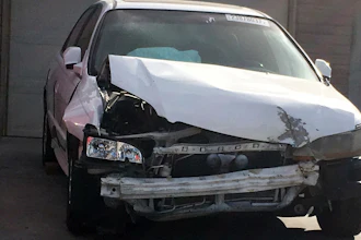 In this Tuesday, April 18, 2017, photo, a 2002 Honda Accord involved in a March 3, 2017, crash in which an exploding Takata air bag inflator badly injured the driver, Karina Dorado, sits in a driveway in Las Vegas. The incident has exposed a danger posed by the recalled parts. Nothing prevents the reuse of air bags from older models to fix wrecked cars that can then be resold, often to unsuspecting buyers.