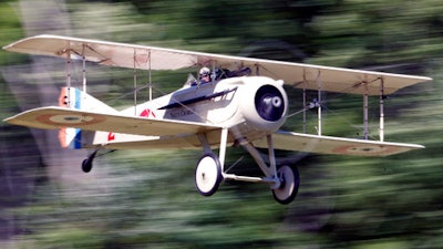 In this July 6, 2014 file photo, Christopher Bulko pilots a Spad VII reproduction bi-plane during an air show at the Old Rhinebeck Aerodrome in Rhinebeck, N.Y. Fighter aircraft such as the Spad VII were used for the first time during World War I. Thursday, April 6, 2017, marks the 100th anniversary of the U.S. entry into World War I, and some of the innovations that were developed or came into wide use during the conflict are still with us today.