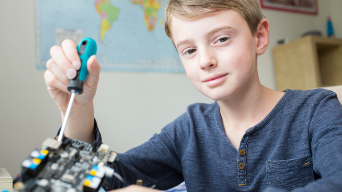 Boy Assembling Robotic Kit In Bedroom 614347300 5760x3840 592f394797e03