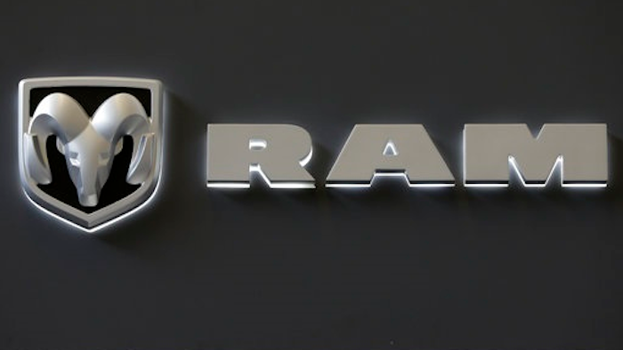 In this Feb. 14, 2013 photo, the Dodge Ram truck logo appears on a sign at the 2013 Pittsburgh Auto Show in Pittsburgh. Fiat Chrysler’s U.S. division is recalling approximately 1 million trucks because of a potential software glitch that could be experienced during a vehicle rollover. The recall includes certain 2013-16 Ram 1500 and 2500 pickups and 2014-2016 Ram 3500 pickups in the U.S. It also affects about 216,007 vehicles in Canada, 21,668 in Mexico and 21,530 outside the NAFTA region.