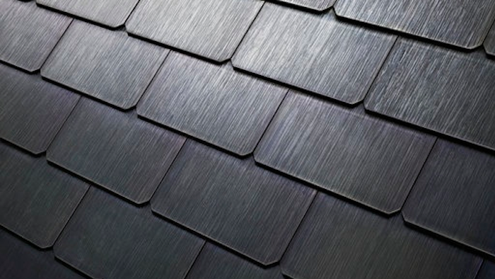 This photo provided by Tesla shows a detail of Tesla's new textured solar roof tiles. As of Wednesday, May 10, 2017, customers worldwide could order a solar roof on Tesla's website. The glass tiles are designed to look like a traditional roof, with options that replicate slate or terracotta tiles. The solar tiles contain photovoltaic cells that are invisible from the street. Installations will begin in June in the U.S., starting with California. Installations outside the U.S. will begin in 2018, the company said.