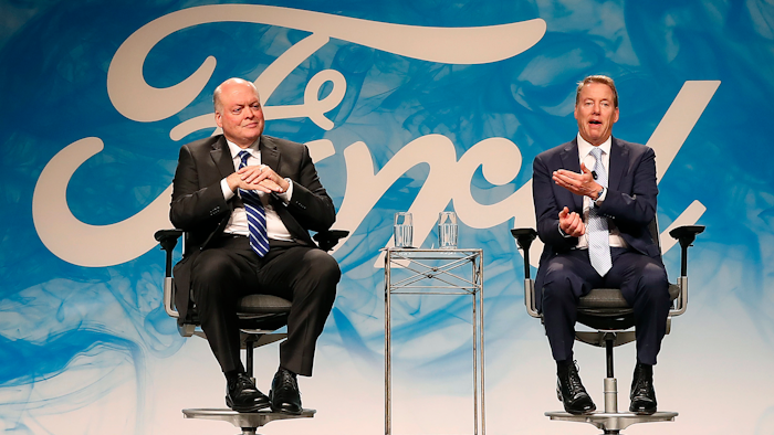 In this Monday, May 22, 2017, file photo, Bill Ford Jr., right, executive chairman of Ford Motor Company, introduces Jim Hackett as CEO, in Dearborn, Mich. Hackett and Ford spoke to The Associated Press about the carmaker's plans to transform itself under new leadership and fix recent quality problems.