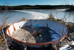 In this Wednesday, Dec. 21, 2016 photo, a deteriorating tank sits on the site of the Callahan Mine in Brockville, Maine. The former open pit copper and zinc mine is now a federal Superfund site. Mining companies that once pursued precious metals have abandoned half a million mines across the country and, thanks to decades of lax regulations, left the bill to taxpayers.