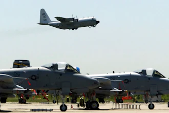 FILE - In this May 13, 2004 file photo, A-10's from the 111th Fighter Wing are seen in the foreground as a U.S. Navy C-130 takes off from N.A.S. J.R.B. Willow Grove in Willow Grove Pa. The Warthog is sitting pretty. Once on the brink of forced retirement, the A-10 attack plane with the ungainly shape and odd nickname has been given new life, spared by Air Force leaders who have reversed the Obama administration’s view of the plane as an unaffordable extra in what had been a time of tight budgets.