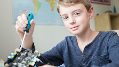 Boy Assembling Robotic Kit In Bedroom 614347300 5760x3840 592f394797e03