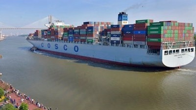 A crowd of well-wishers along River Street welcome the container ship COSCO Development, Thursday morning, May 11, 2017, in Savannah, Ga, as the vessel sails up the Savannah River to the Port of Savannah. The ship is the largest vessel ever to call on the U.S. East Coast.