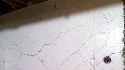 In this April 11, 2017 photo, numerous cracks run through a basement wall of Tim Heim's home in Willington, Conn. Home foundations in a part of the state are failing because of the presence of the mineral pyrrhotite in the concrete, and a growing number of homeowners are seeking financial relief from their town.
