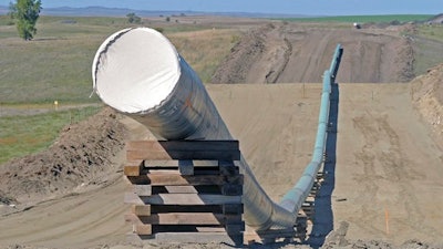 This Sept. 29, 2016, file photo, shows a section of the Dakota Access pipeline under construction near St. Anthony in Morton County, N.D. The Dakota Access pipeline system leaked about 100 gallons of oil in western North Dakota in two separate incidents in March as crews worked to get the four-state line ready for operation. They’re the second and third known leaks on the disputed $3.8 billion pipeline.