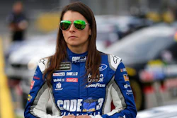 Danica Patrick stands by her car before qualifying for Sunday's NASCAR Cup series auto race at Charlotte Motor Speedway in Concord, N.C., Thursday, May 25, 2017.