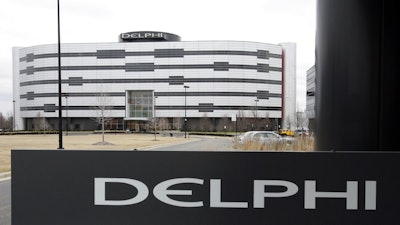 In this March 22, 2006, file photo, Delphi's World Headquarters is shown in Troy, Mich. Automotive parts and electronics maker Delphi Corp. is the latest partner to join BMW, Intel and Mobileye to develop autonomous vehicles. The companies announced Tuesday, May 16, 2017, that Delphi will work with the companies to integrate autonomous driving systems. They plan to have a self-driving system ready by 2021.