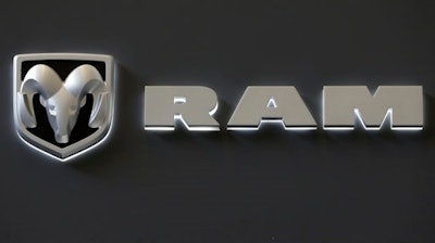 In this Feb. 14, 2013 photo, the Dodge Ram truck logo appears on a sign at the 2013 Pittsburgh Auto Show in Pittsburgh. Fiat Chrysler’s U.S. division is recalling approximately 1 million trucks because of a potential software glitch that could be experienced during a vehicle rollover. The recall includes certain 2013-16 Ram 1500 and 2500 pickups and 2014-2016 Ram 3500 pickups in the U.S. It also affects about 216,007 vehicles in Canada, 21,668 in Mexico and 21,530 outside the NAFTA region.