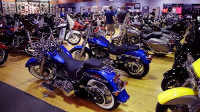 In this Monday, April 24, 2017, photo, Harley-Davidson motorcycles are displayed on the showroom floor at the Motorcycles of Manchester dealership in Manchester, N.H. On Friday, May 26, 2017, the Commerce Department releases its April report on durable goods.