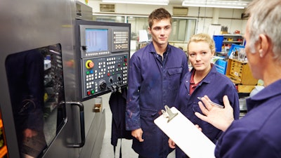 Engineer Teaching Apprentices To Use Computerized Lathe 458860281 2122x1415 1 591f0b14e9fcf