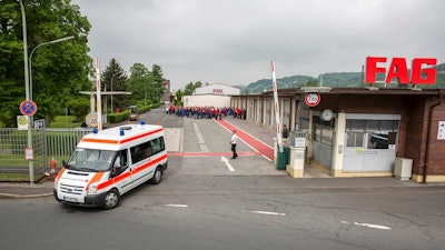 An ambulance leaves FAG Schaeffler company in Eltmann, Germany, Monday, May 15, 2017. German police say 13 people have been injured in an explosion in the factory in Bavaria. Police said the four of those injured in the Monday morning explosion suffered from serious wounds and were flown by helicopter to a hospital.
