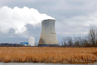 In this April 4, 2017, file photo, plumes of steam drift from the cooling tower of FirstEnergy Corp.'s Davis-Besse Nuclear Power Station in Oak Harbor, Ohio. Opponents of a proposed bailout of Ohio's two nuclear plants are praising a Wednesday, May 17, 2017, decision in the state House Public Utilities Committee to suspend testimony on a bill criticized by consumer, business and energy groups, even as FirstEnergy Corp., based in Akron, Ohio, continues to push for the deal.