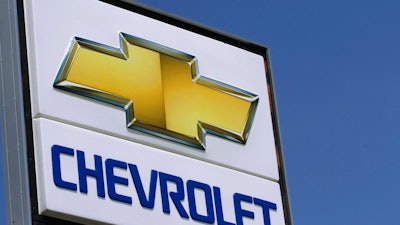 In this July 8, 2012 file photo, the Chevrolet logo is seen at an auto dealership in Springfield, Ill. General Motors Co. is pulling its Chevrolet brand out of India, South Africa and East Africa by the end of 2017. The company will retain its assembly plant in India but will only make vehicles for export. It is selling a plant in South Africa to Isuzu Motors.