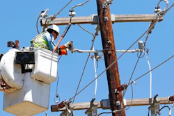 In this Monday, May 1, 2017, file photo, a Greenwood Utilities lineman works on power lines in Durant, Miss., as cleanup continues from a possible tornado that swept through the rural community a day earlier. On Tuesday, May 16, 2017, the Federal Reserve reports on industrial production for April.