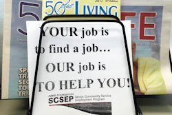 In this May 18, 2017, photo, a sign for the Senior Community Service Employment Program at the AARP Foundation in Harrisburg, Pa. The half-century-old Senior Community Service Employee Program, is a training and placement program underwritten by taxpayers aimed at putting older Americans back into the workforce. President Donald Trump says there are too few participants who find work that’s not paid for by the federal government. This week, he proposed deleting the $434 million program from the federal budget _ a strike at a piece of President Lyndon Johnson’s “war on poverty.”