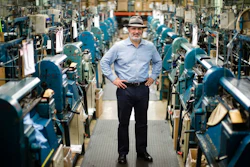Don Rongione, President and Chief Operating Officer of Bollman Hat Company poses for a photograph with knitting machine used in the manufacturing of Kangol hats the Bollman Hat Company in Adamstown, Pa., Monday, May 1, 2017. When the famous hat brand moved into the Pennsylvania factory last year from China, executives with the Bollman Hat Co. billed it as an effort to create U.S. manufacturing jobs. “It has been certainly a bigger challenge than what we could've ever dreamed,” said Rongione.