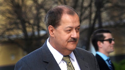In a Wednesday, April 6, 2016, file photo, former Massey CEO Don Blankenship is escorted by Homeland Security officers from the Robert C. Byrd U.S. Courthouse in Charleston, W. Va. Blankenship has asked President Donald Trump to resist attempts in Congress to enhance criminal penalties for coal executives who violate mine safety and health standards. Blankenship, who recently was freed from federal prison, also asked the president in a letter Tuesday, May 16, 2017, to re-examine a federal investigation into the nation's worst coal mining disaster in four decades.