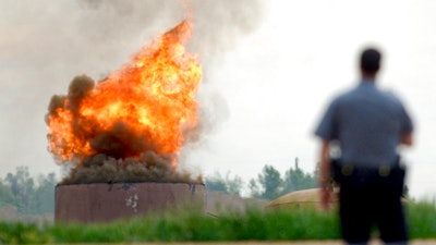 An oil tank burns after an explosion at a tank battery owned by Anadarko near the Grand View Estates neighborhood in Weld County on Thursday, May 25, 2017 in Mead, Colo. The fatal oil tank battery fire in northern Colorado appears to be unrelated to a nearby home explosion last month caused by a leaky gas line.