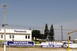 This April 28, 2017 photo shows a sign that says 'We're hiring' outside a Panasonic 'maquiladora' in an industrial park in Reynosa, Mexico, across the border from McAllen, Texas. A long-time factory worker said he worried that if maquila jobs decrease, the unemployed would fill the ranks of a drug cartels that control Mexican border towns.