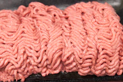 This March 29, 2012, file photo, shows the beef product that critics call 'pink slime' during a plant tour of Beef Products Inc. in South Sioux City, Neb. Jury selection is set to start Wednesday, May 31, 2017, in a defamation case over ABC news reports on a South Dakota meat producer's lean, finely textured beef product, which critics dubbed 'pink slime.' Dakota Dunes-based Beef Products Inc. sued the TV network in 2012. It says ABC misled consumers into believing the product is unsafe, leading to layoffs and plant closures.