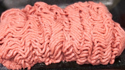 This March 29, 2012, file photo, shows the beef product that critics call 'pink slime' during a plant tour of Beef Products Inc. in South Sioux City, Neb. Jury selection is set to start Wednesday, May 31, 2017, in a defamation case over ABC news reports on a South Dakota meat producer's lean, finely textured beef product, which critics dubbed 'pink slime.' Dakota Dunes-based Beef Products Inc. sued the TV network in 2012. It says ABC misled consumers into believing the product is unsafe, leading to layoffs and plant closures.