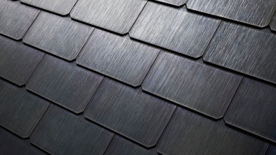 This photo provided by Tesla shows a detail of Tesla's new textured solar roof tiles. As of Wednesday, May 10, 2017, customers worldwide could order a solar roof on Tesla's website. The glass tiles are designed to look like a traditional roof, with options that replicate slate or terracotta tiles. The solar tiles contain photovoltaic cells that are invisible from the street. Installations will begin in June in the U.S., starting with California. Installations outside the U.S. will begin in 2018, the company said.