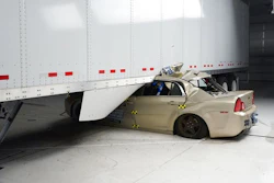 In this April 2017 photo provided by the Insurance Institute for Highway Safety, a Chevrolet Malibu underrides a tractor-trailer in a 35 mph crash test. The trailer has an aerodynamic skirt but no underride guard. Federal law requires big trucks to have rear underride guards, which stop cars from traveling underneath the truck in an accident. But the government doesn’t require side guards. The Insurance Institute for Highway Safety says side guards could prevent hundreds of traffic deaths per year.
