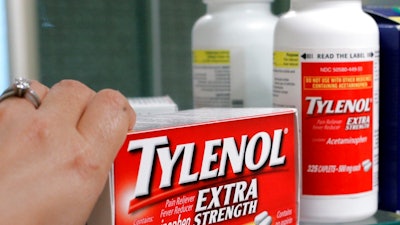 In this June 30, 2009, file photo, Tylenol Extra Strength is shown in a medicine cabinet at a home in Palo Alto, Calif. In a settlement announced Wednesday, May 24, 2017, Johnson & Johnson reached a $33 million settlement with 42 states, resolving allegations the health care giant sold numerous nonprescription medicines that didn’t meet federal quality requirements for a couple of years. The case dates to 2009, when Johnson & Johnson began dozens of voluntary recalls of popular over-the-counter medicines for children and adults, including Tylenol, Motrin and Benadryl.
