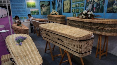 Wicker and seagrass coffins are displayed at the Asia Funeral and Cemetery Expo & Conference in Hong Kong, Thursday, May 18, 2017. The expo underscores how for some investors Asia's rapidly aging population makes its death industry a potentially lucrative market. Asia's aging population is projected to hit 923 million by mid-century, according to an Asian Development Bank, putting the region on track to become the oldest in the world.