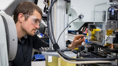 Argonne materials scientist Andrew Ulvestad examines a sample at Argonne's Advanced Photon Source.