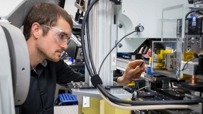 Argonne materials scientist Andrew Ulvestad examines a sample at Argonne's Advanced Photon Source.