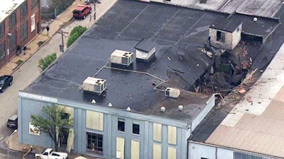 This April 3, 2017 file photo from video provided by KMOV shows damage to the roof of the Loy-Lange Box Co. in St. Louis after a steam condensation tank exploded and flew before crashing through the roof of a nearby laundry business. The U.S. Chemical Safety and Hazard Investigation Board released in findings Thursday, May 25, 2017, of its investigation into the explosion that killed several people.