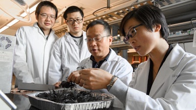 Washington State University Professor Jinwen Zhang with his carbon fiber recycling research team.