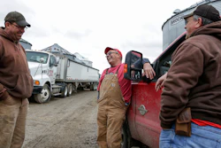 Blake Hurst, a corn and soybean farmer and president of the Missouri Farm Bureau, center, jokes with his brothers Brooks Hurst, left, and Kevin Hurst, right, on his farm in Westboro, MO.