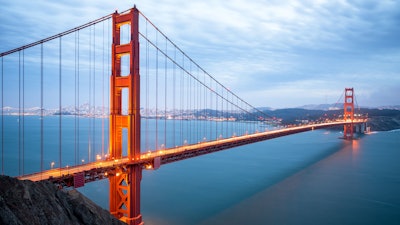 The Golden Gate Bridge is a suspension bridge, meaning it relies on cables and suspenders under tension along with towers under compression to cross a long distance without any intermediate supports.