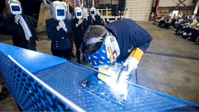 A welder authenticates the keel of LCS 19, the future USS St. Louis, by welding the initials of ship sponsor Barbara Broadhurst Taylor. The Keel Laying is the formal recognition of the start of the ship’s module construction process.