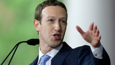 Facebook CEO and Harvard dropout Mark Zuckerberg delivers the commencement address at Harvard University commencement exercises, Thursday, May 25, 2017, in Cambridge, Mass.